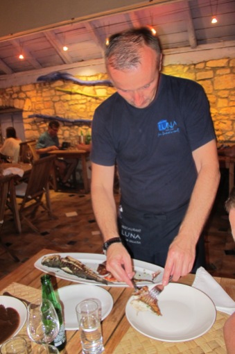 The chef presenting the fish